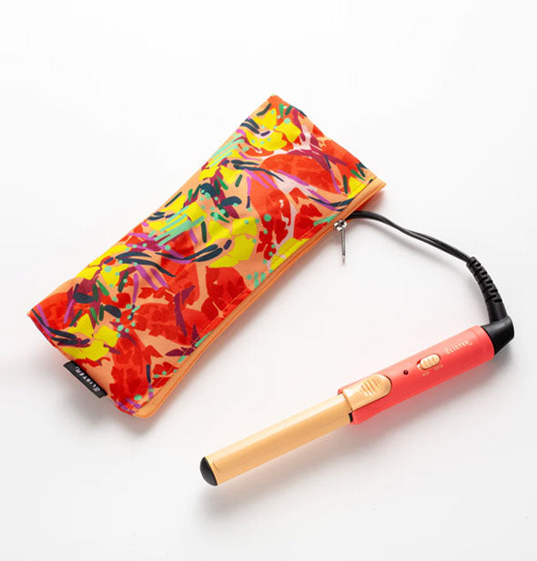 Grapefruit and gold mini curling iron with matching floral pouch