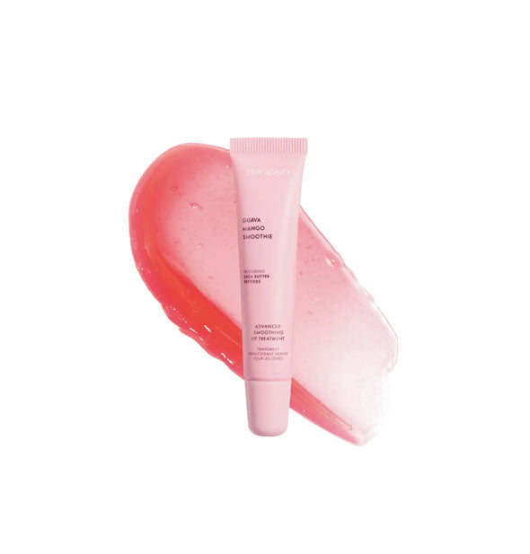 Pink tube of Guava Mango Smoothie lip treatment overtop an enlarged pink sample application of product