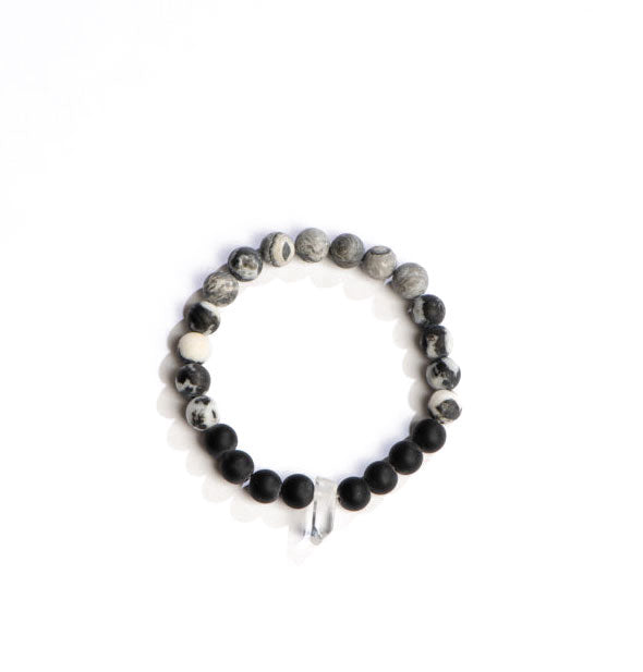 Beaded bracelet with patterned gray, black and white stones accented with a central clear crystal point