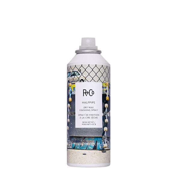 5 ounce can of R+Co Halfpipe Dry Wax Finishing Spray with label featuring skateboards and a chain link fence design