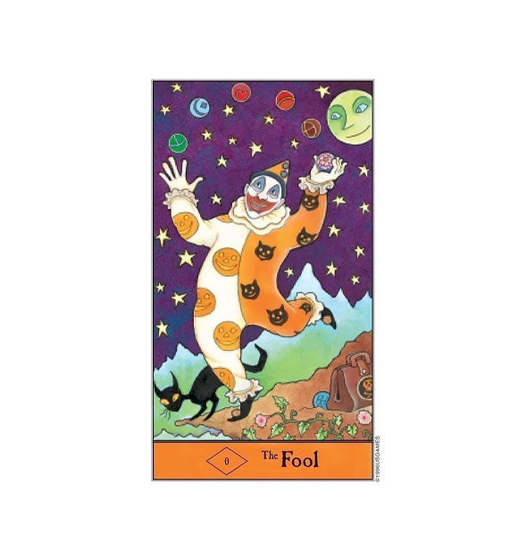 The Fool tarot card features an illustration of a jester in pumpkin- and black cat-patterned suit holding an orb under a starry sky with smiling moon