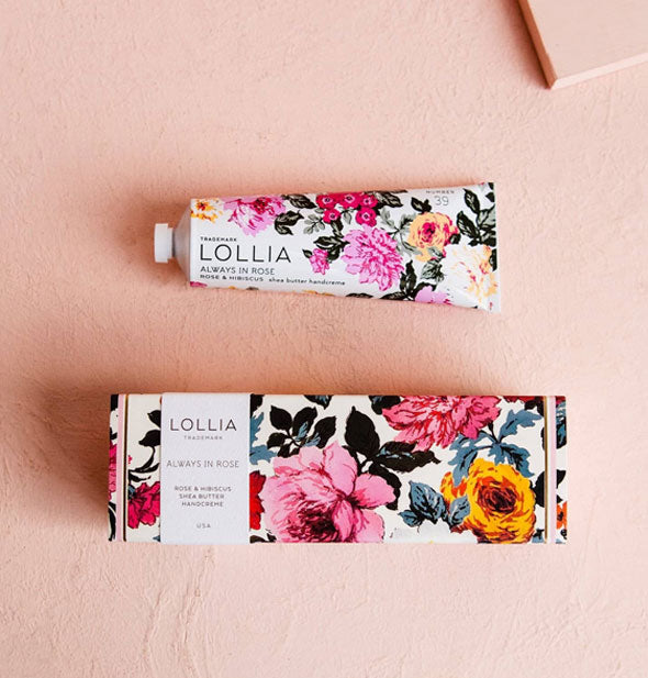 Tube and box of Lollia Always In Rose Handcreme with colorful floral patterning