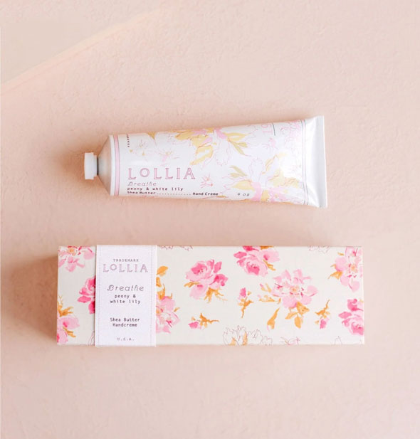 White tube and box of Lollia Breathe Handcreme both feature pink and gold floral patterning