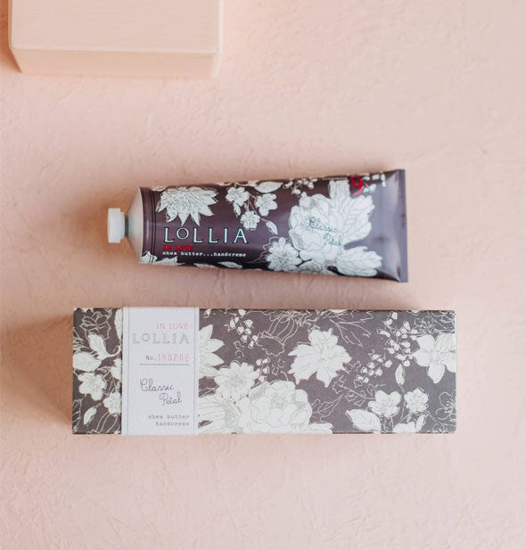 Tube and box of Lollia Classic Petal Handcreme both feature warm gray and white floral patterning