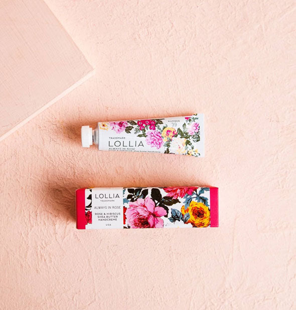 Mini tube and box of Lollia Always In Rose Handcreme with colorful floral patterning
