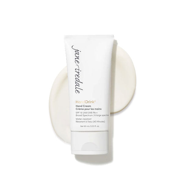 White 2 ounce tube of Jane Iredale HandDrink Hand Cream with sample application of product behind it