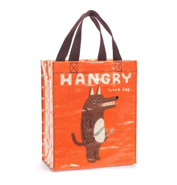 Orange tote bag with brown handles features illustration of a toothy wolf-like creature holding a knife and fork and says, "Hangry Lunch Bag" in white lettering