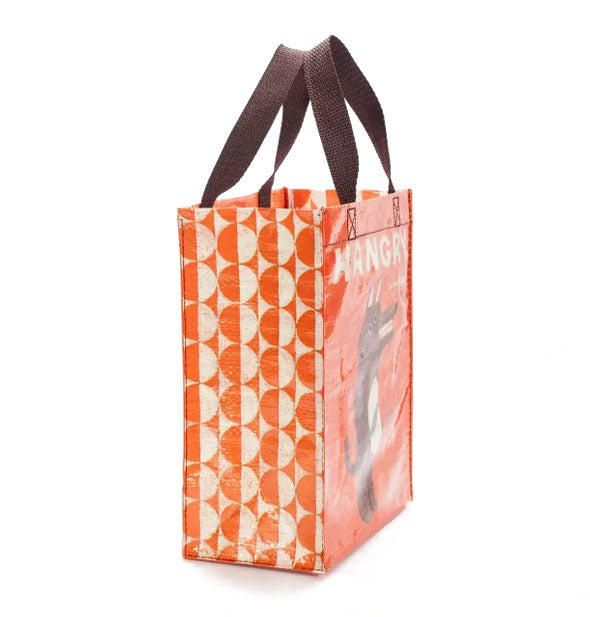 Hangry Handy Tote side panel is a white and orange circles and half circles print