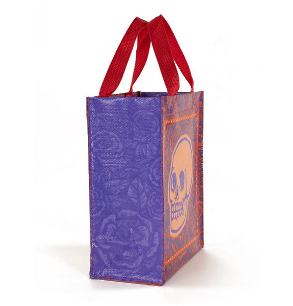 Side panel of the Skulls & Rose Handy Tote shows its repeated rose pattern in purple