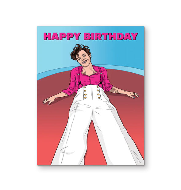 Greeting card features illustration of Harry Styles wearing white pants and a pink shirt laying back on a red surface against a blue backdrop with the words, "Happy birthday" across it in pink lettering