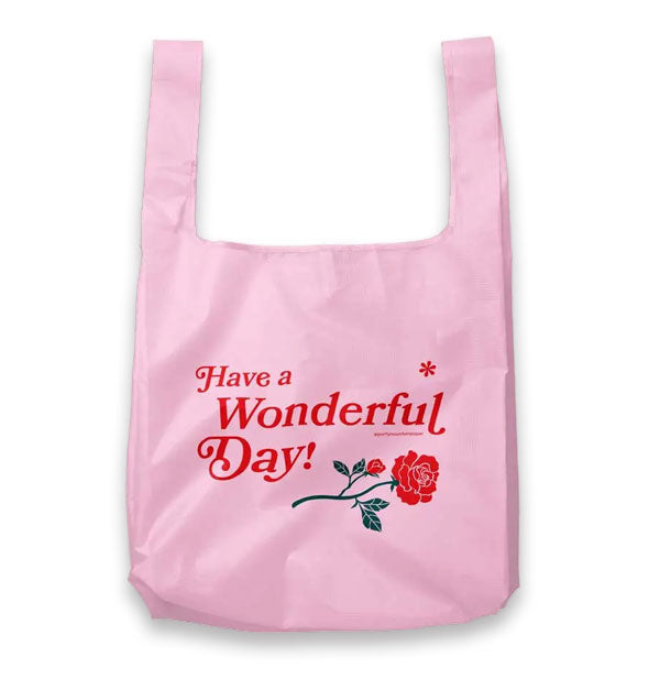 Pink tote bag says, "Have a Wonderful Day!" in red lettering with an asterisk accent and rose graphic