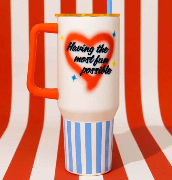 Having the Most Fun Possible drink tumbler against a red and white striped backdrop