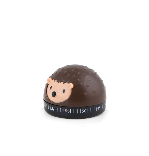 Brown domed kitchen timer with nubby texture resembles a hedgehog with light-colored face