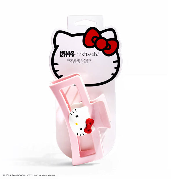 Light pink open shape rectangular claw clip with Hello Kitty face at the center is attached to a graphic branded product card