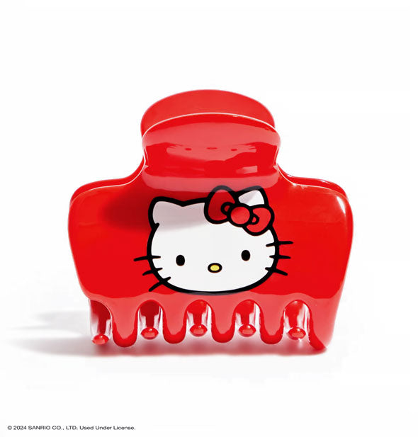 Red snubby hair claw clip with Hello Kitty face in the center