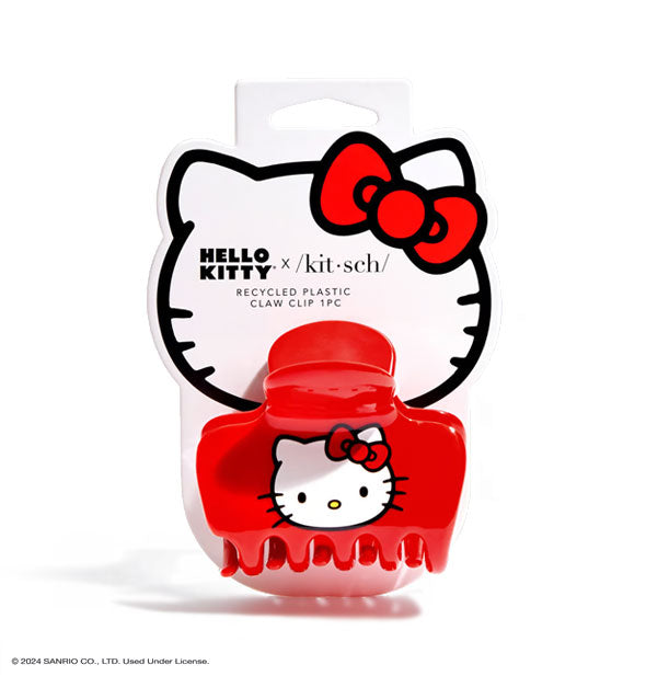 Red claw clip with hello kitty face imprint is attached to a graphic branded Hello Kitty product card