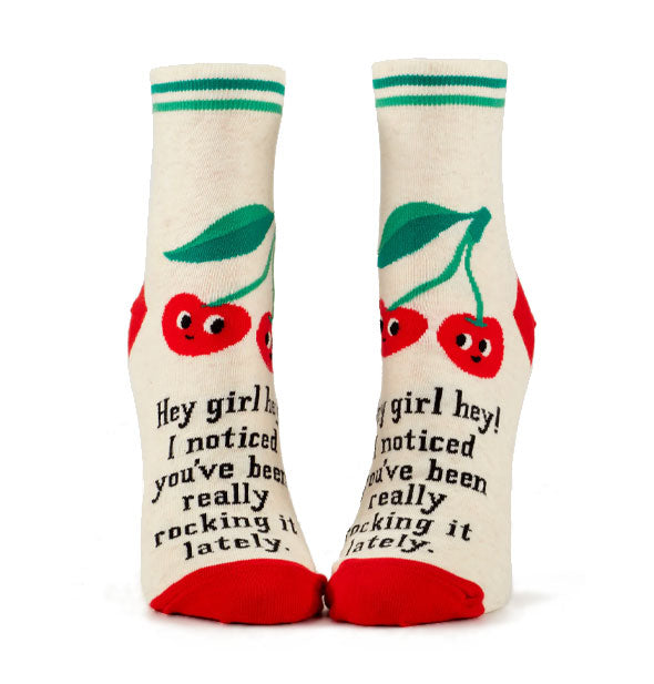 White ankle socks with double green ankle stripes, red toes and heels, and smiley cherries graphics say, "Hey girl hey! I noticed you've been really rocking it lately" in black lettering