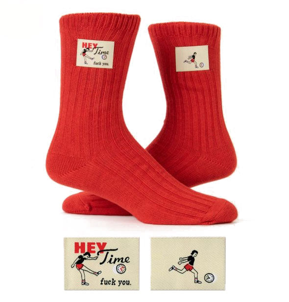 Pair of red socks, one of which features a tag that says, "Hey Time, fuck you"