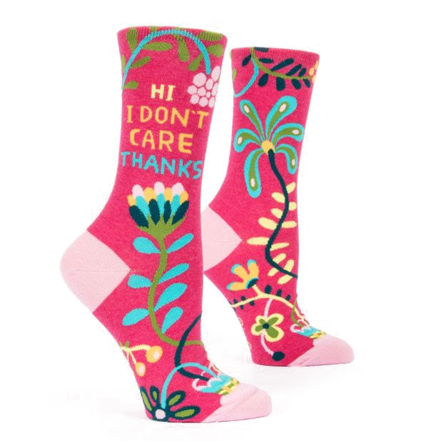 Magenta crew socks with pink accents and colorful florals say, "Hi, I don't care, thanks" on the ankles