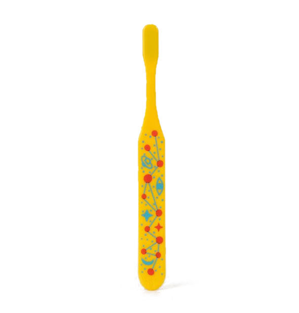 Back side of yellow toothbrush features orange and blue celestial-themed design on handle