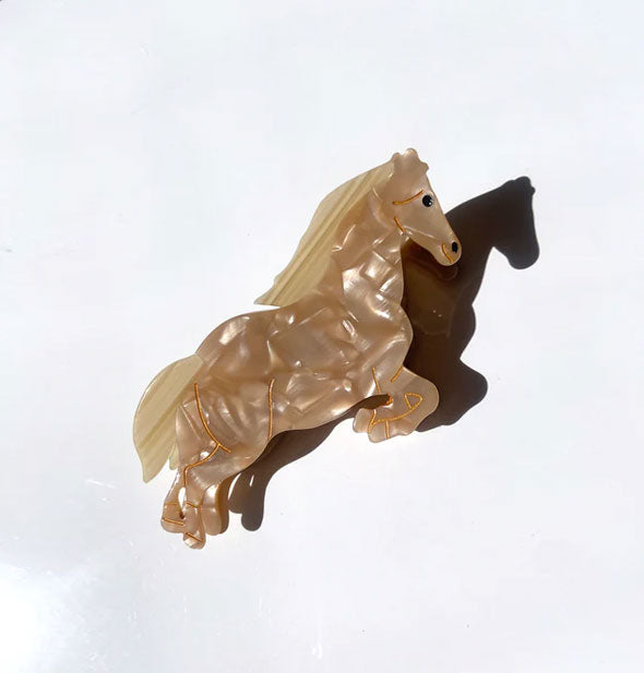 Blonde quartz-effect jumping horse hair clip with gold facial and body line details