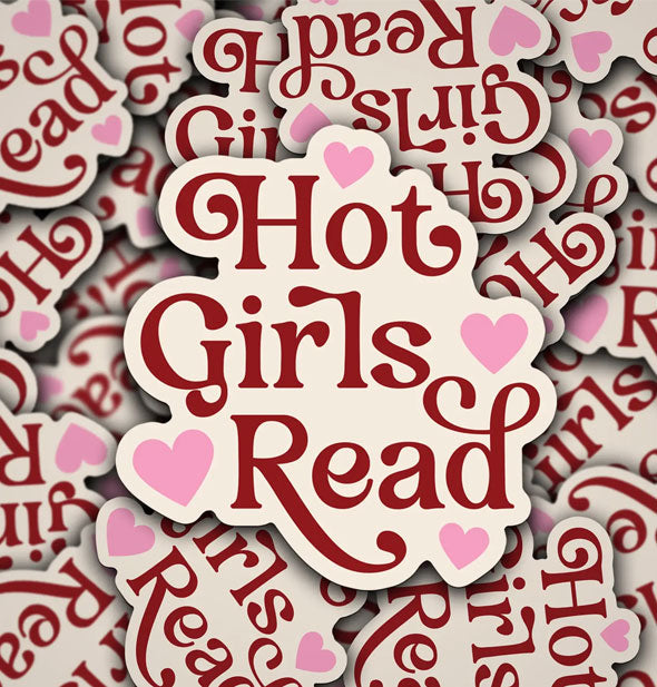 Pile of stickers that say, "Hot Girls Read" in red lettering accented by pink stars