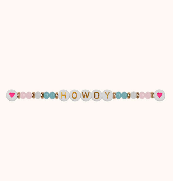 "Howdy" beaded bracelet with gold, pastel, and heart accent beads