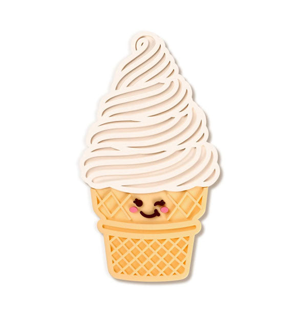 Silicone mat with winking face resembles a soft serve vanilla ice cream cone with grooves