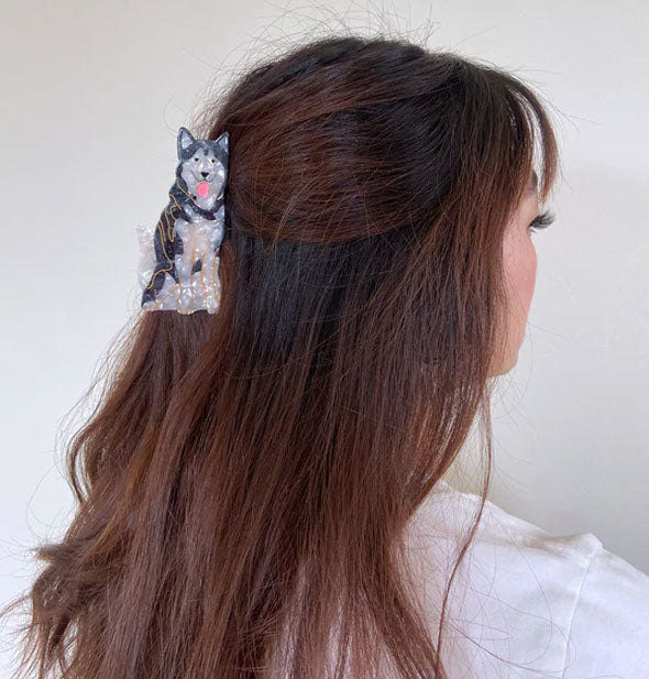 Model wears a Siberian husky hair clip in a partially swept-back style