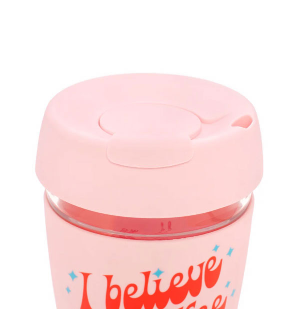 Closeup of pink silicone travel mug lid