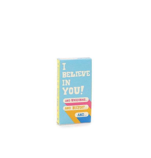 Rectangular gum pack features blue, pink, yellow, and white design that says, "I believe in you! And unicorns...and Bigfoot...and..."