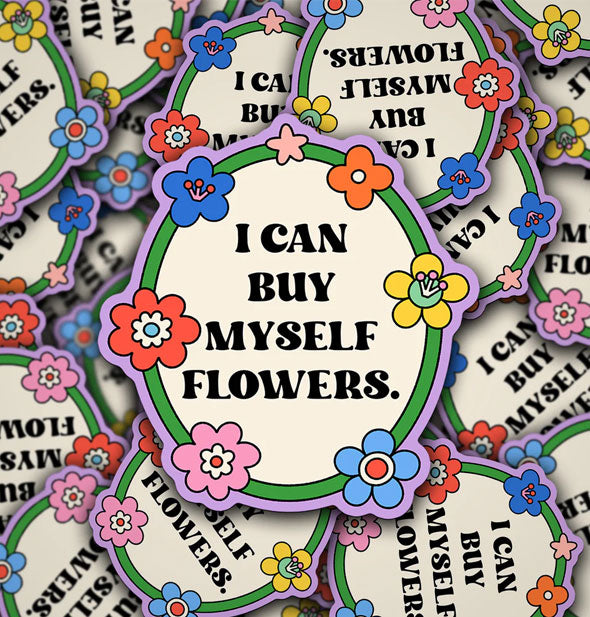 Pile of stickers with illustrated floral borders say, "I can buy myself flowers."