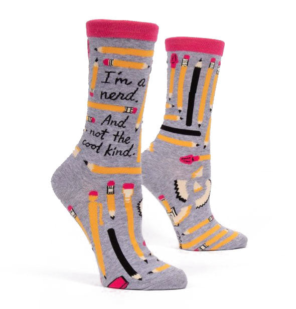 Gray crew socks with pink rims and pencil graphics say, "I'm a nerd. And not the cool kind."