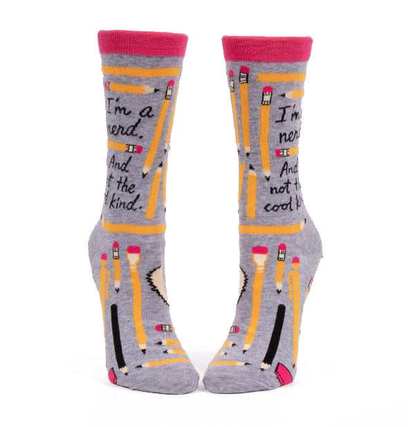 Gray crew socks with pink rims and pencil graphics say, "I'm a nerd. And not the cool kind."