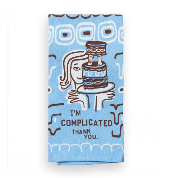 Blue, brown, and white dish towel with illustration of a woman holding an elaborate cake on a platter says, "I'm complicated, thank you."