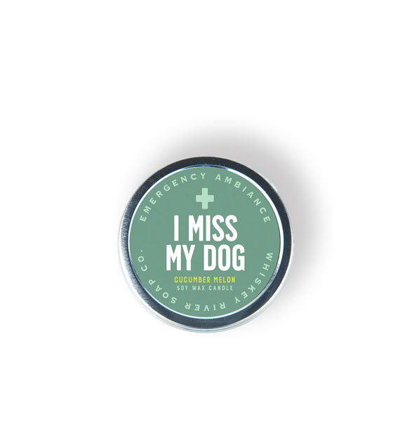 Round Emergency Ambiance soy wax candle for I Miss My Dog features a teal label with green and white lettering
