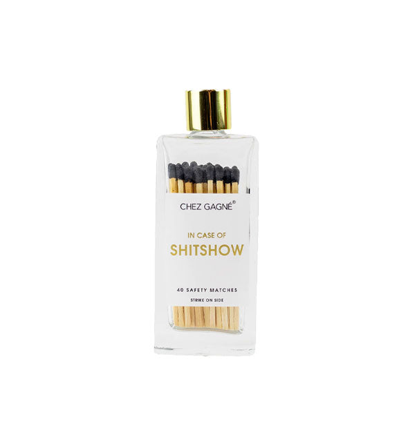 Rectangular glass bottle containing 40 black-tipped Chez Gagné safety matches and topped with a gold lid says, "In Case of Shitshow" in gold foil