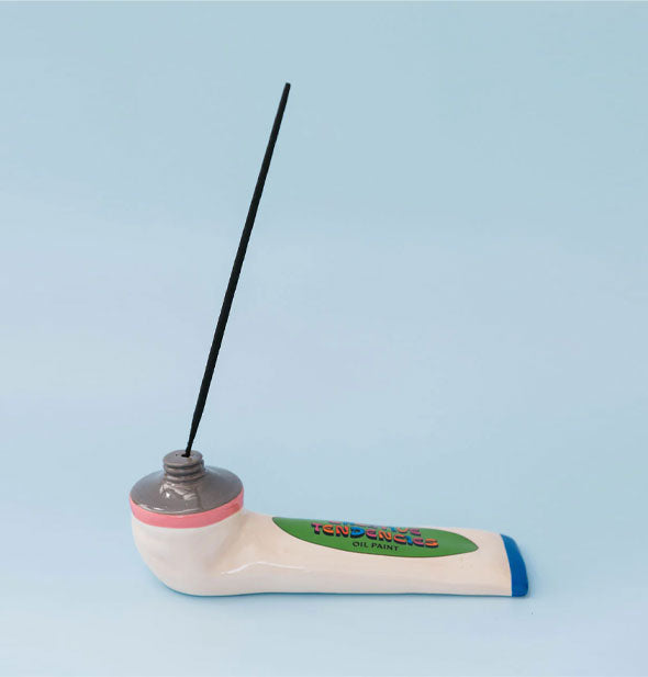Paint Tube Incense Holder is shown with a stick of incense inserted into its "nozzle"