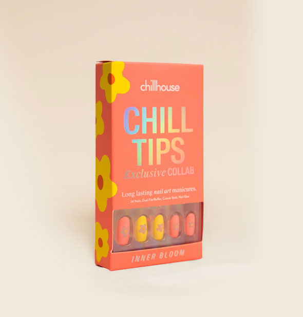 Peach-colored Chillhouse Chill Tips box with yellow floral design along the side features nails in similar shades with flower cutout designs on each visible through the packaging window