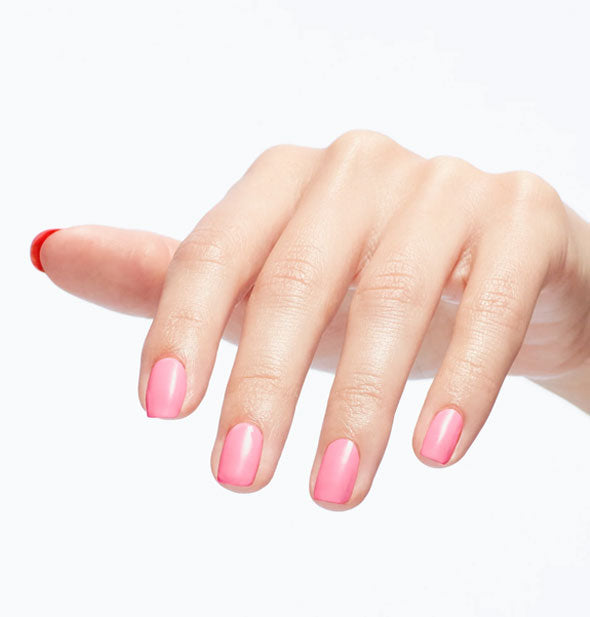 Model's fingernails are painted in light pink polish