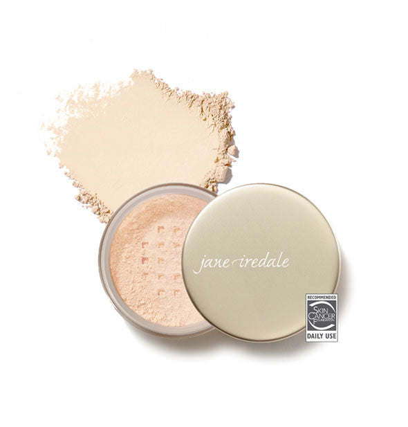 Opened compact of Jane Iredale Amazing Base Loose Mineral Powder and sample product swatch in shade Ivory with the Skin Cancer Foundation seal at lower right