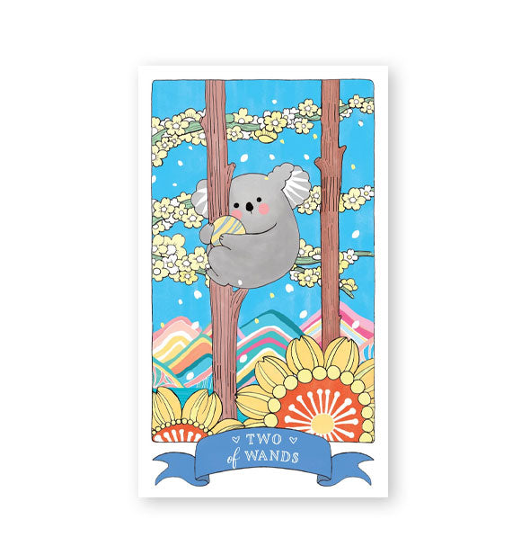 Sample Two of Wands card from the Kawaii Tarot deck features koala illustration with colorful mountains and prominent florals