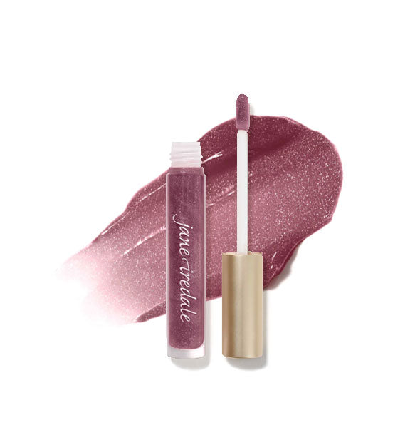 Tube of Jane Iredale HydroPure Hyaluronic Acid Lip Gloss with doe foot applicator cap removed and sample enlarged product application behind in shade Kir Royale