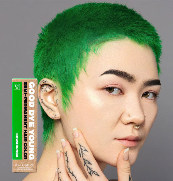 Model wears a bright green short haircut; box of Good Dye Young Semi-Permanent Hair Color in shade Kowabunga is inset at bottom left