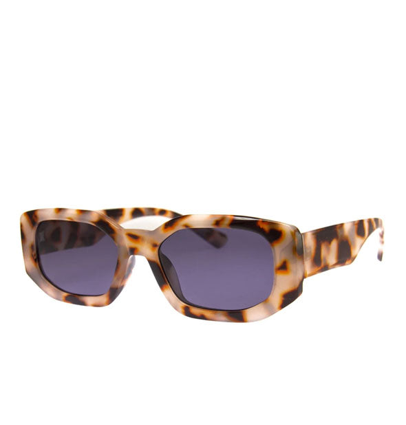 Angular sunglasses with a light brown leopard-tortoise frame and grayish-blue lenses