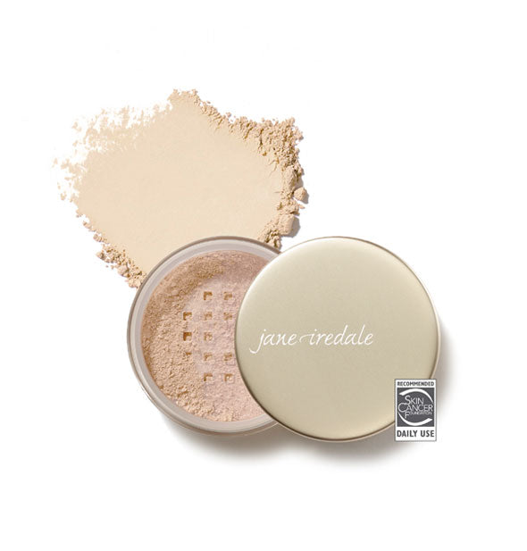 Opened compact of Jane Iredale Amazing Base Loose Mineral Powder and sample product swatch in shade Light Beige with the Skin Cancer Foundation seal at lower right