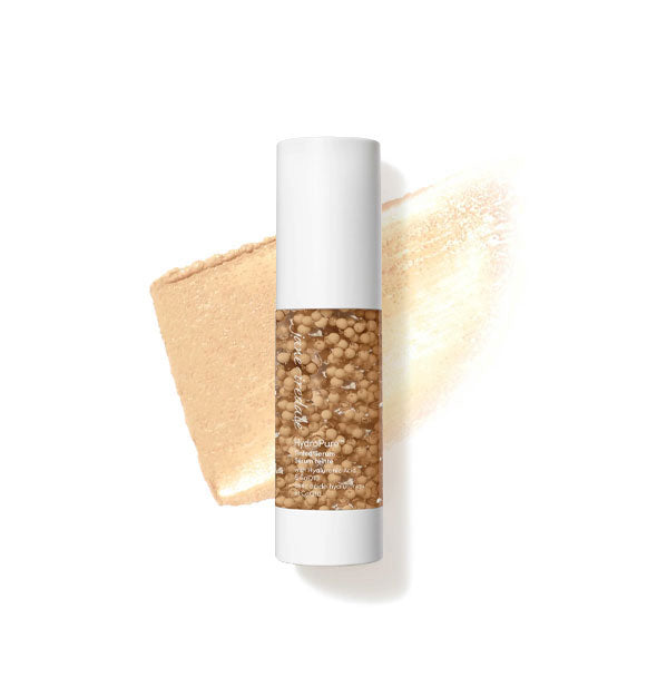 Bottle of Jane Iredale HydroPure Tinted Serum with color capsules visible through clear packaging and a sample application behind in the shade Light to Medium 3