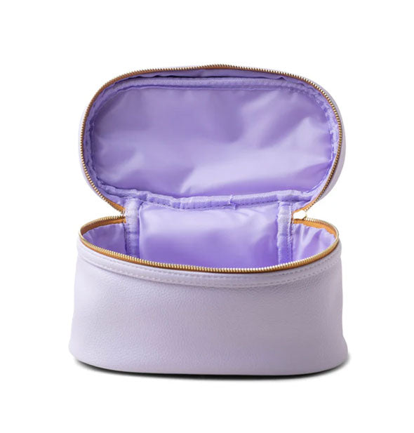 Purple vegan leather travel case with copper zipper tape and gold-toned zipper is opened to show purple nylon lining