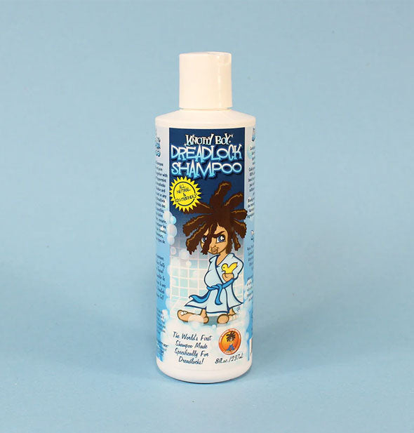 8 ounce bottle of Knotty Boy Dreadlock Shampoo features label illustration of a person with dreadlocks wearing a blue bathrobe and holding a yellow rubber ducky