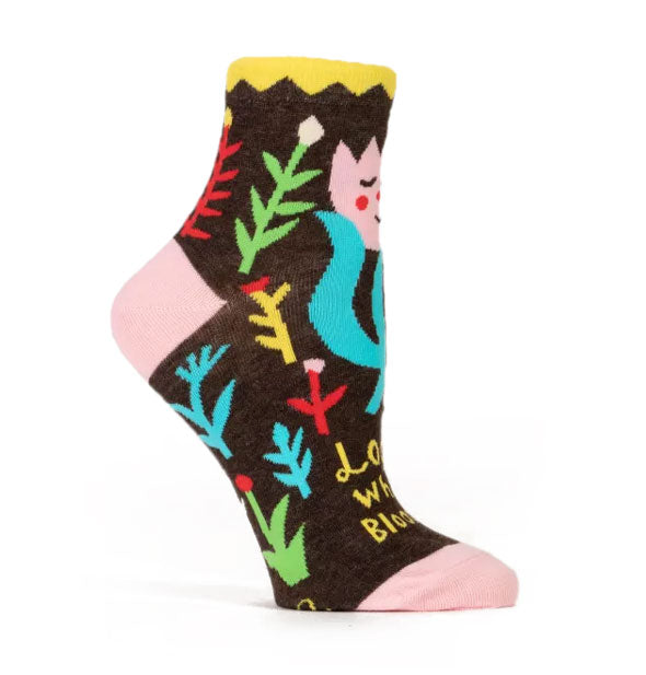Dark brown ankle sock with yellow zig zag top band, pink heel, and pink toe features colorful flower designs and yellow lettering